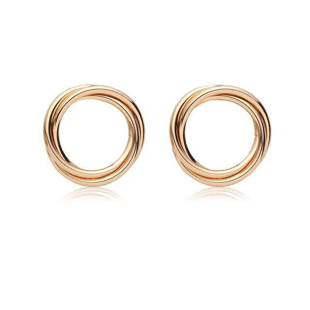 House of Royal Nara gold hoop earrings on plain background