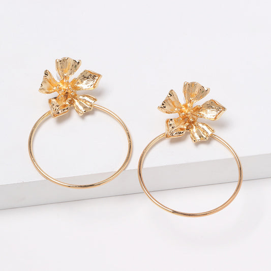 House of Royal Carmelle gold hoop earrings with flower product image on white background