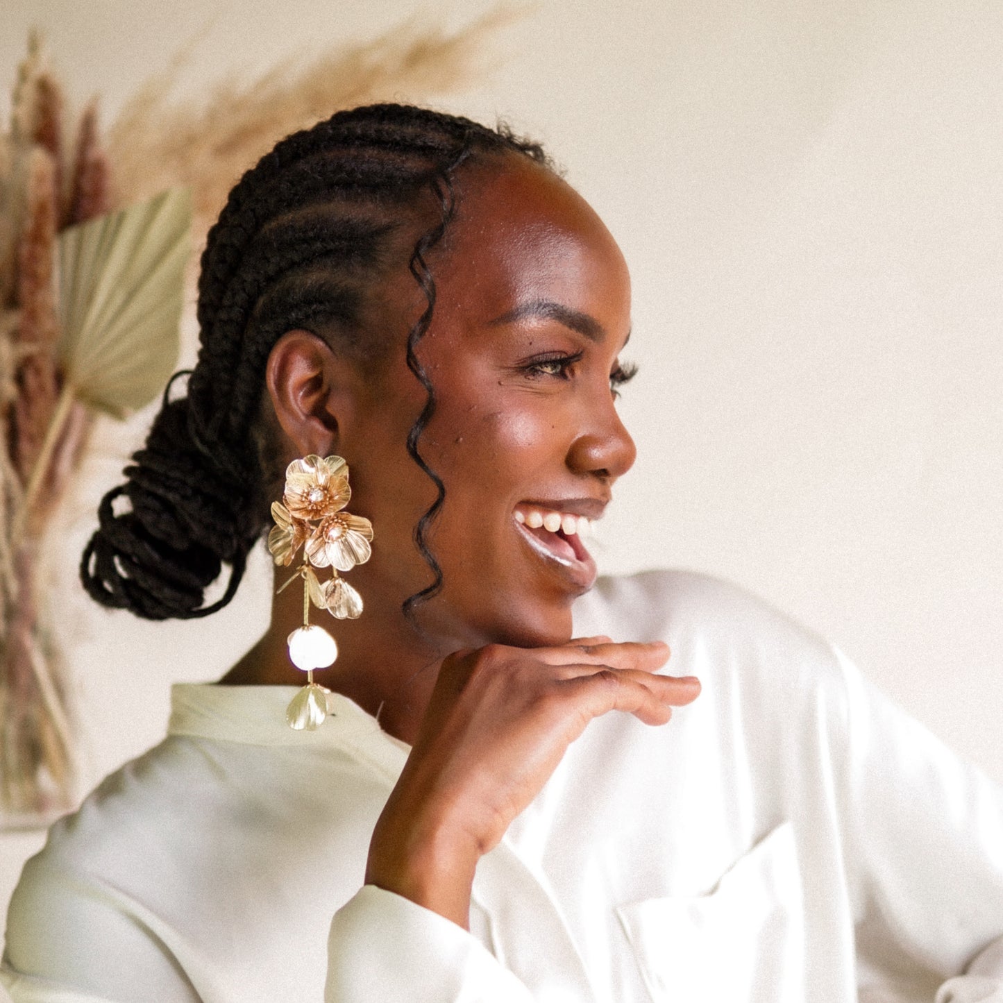 House of Royal Ayla Floral design gold earrings on model