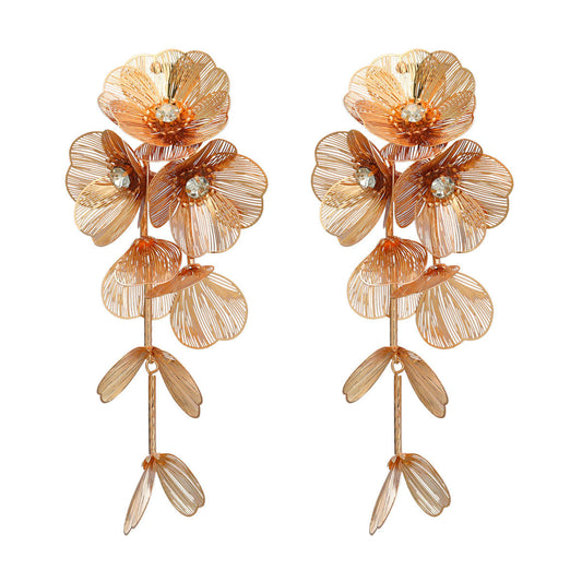 House of Royal Ayla Floral design gold earrings on plain background