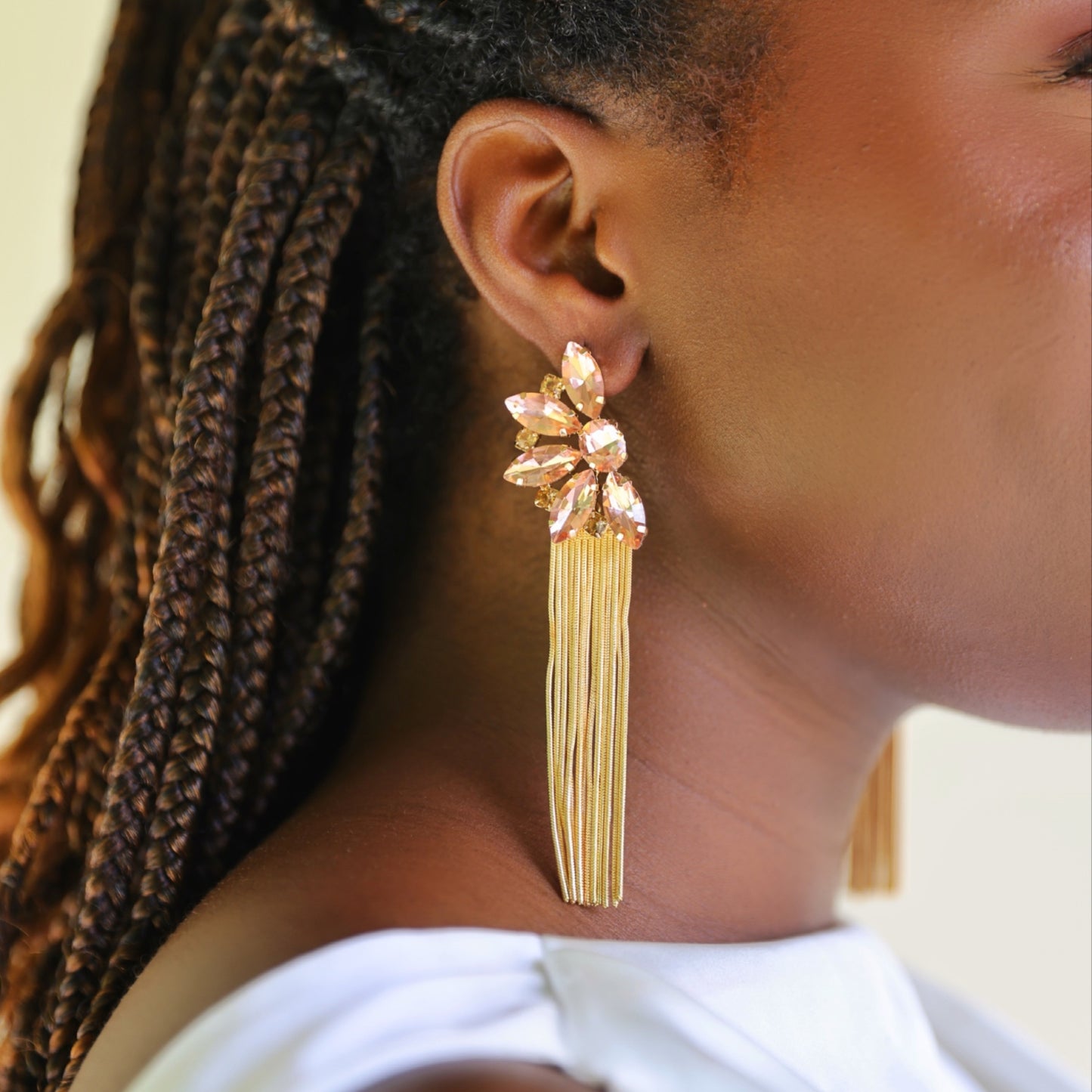 House of Royal Yarona rose gold earrings with floral gem stones design on model