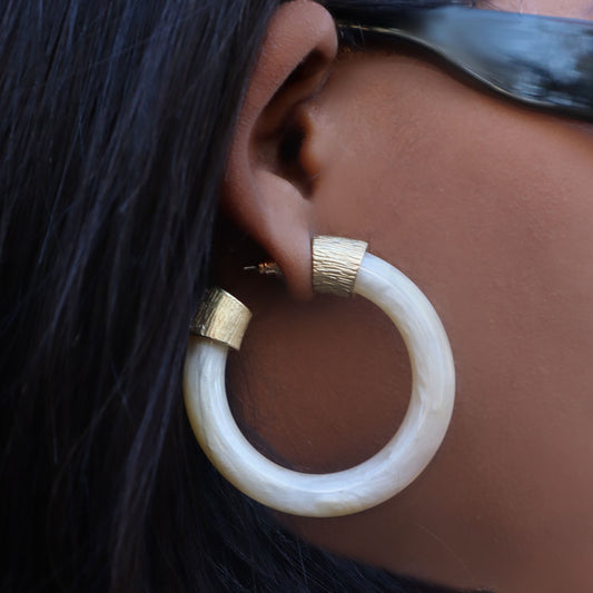 House of Royal Loisa chunky gold hoop earrings with marble design on model