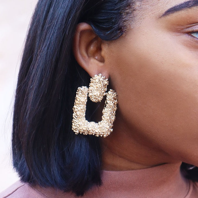 House of Royal Larselle gold earrings on model