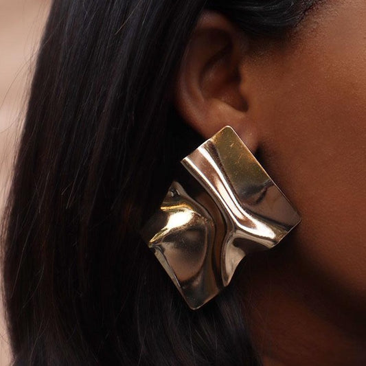 House of Royal Bernice abstract foil design statement gold earrings on model