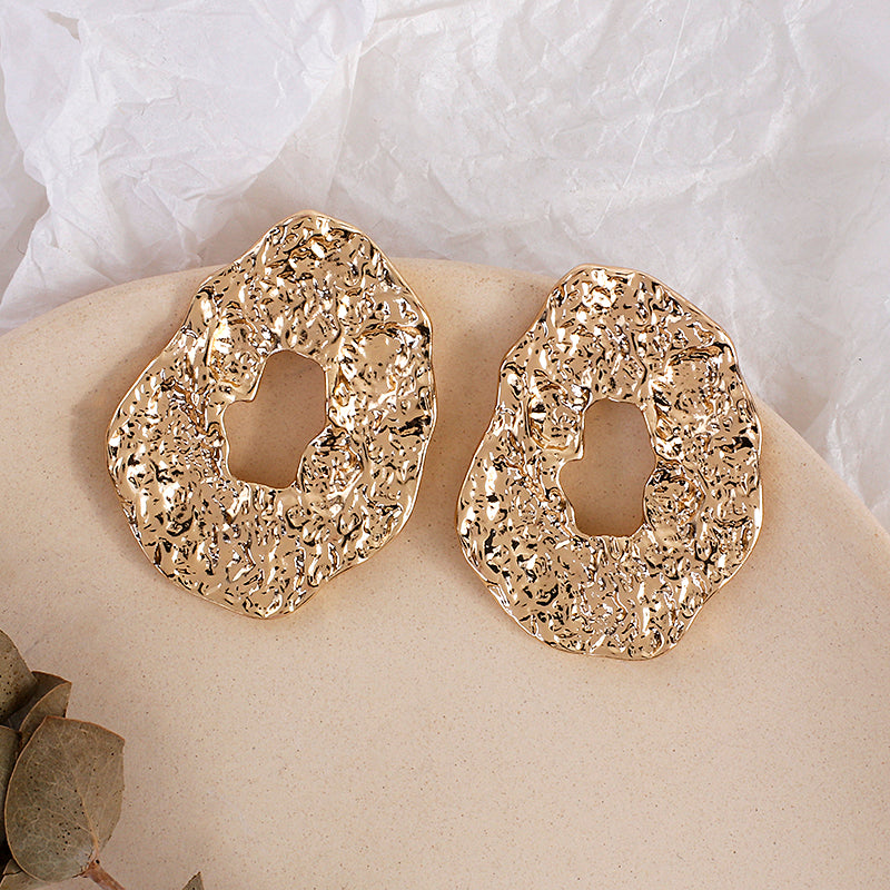 House of Royal Salomé abstract and textured gold earrings product image on plate