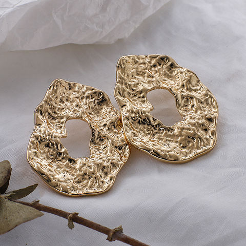 House of Royal Salomé abstract and textured gold earrings product image on paper