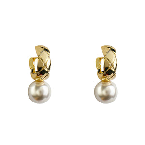 House of Royal Daniela pearl and gold earrings on plain background
