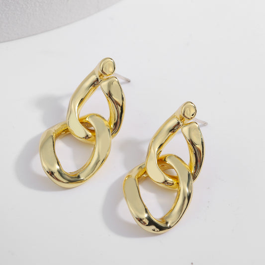 House of Royal Eva small cuban link gold earrings on plain background flat